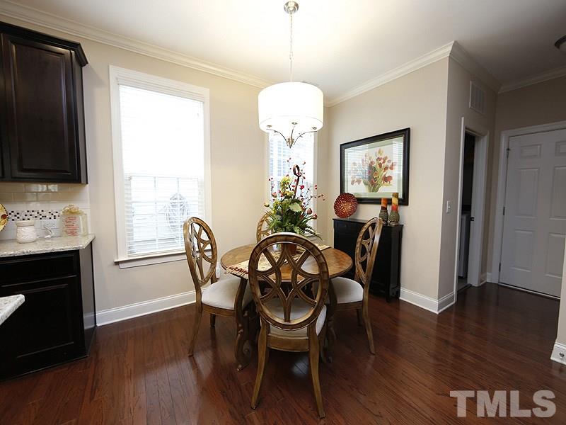 1145 Chapanoke Road Raleigh, NC 27603 - Photo 12 of 25 The open plan makes it easy to host just a few people or a large group of friends and/or family.