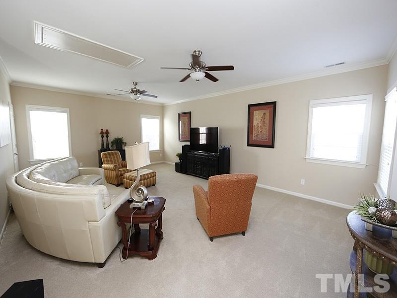 1145 Chapanoke Road Raleigh, NC 27603 - Photo 18 of 25 A huge bonus room with large walk-in closet is a great place to kick back, relax, play games, watch TV, read a book and enjoy time at home! The natural light in this home is fabulous!