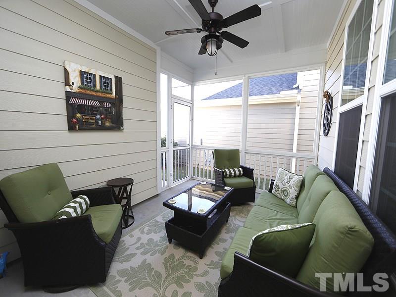 1145 Chapanoke Road Raleigh, NC 27603 - Photo 23 of 25 Enjoy the outdoors while relaxing on the screened porch.