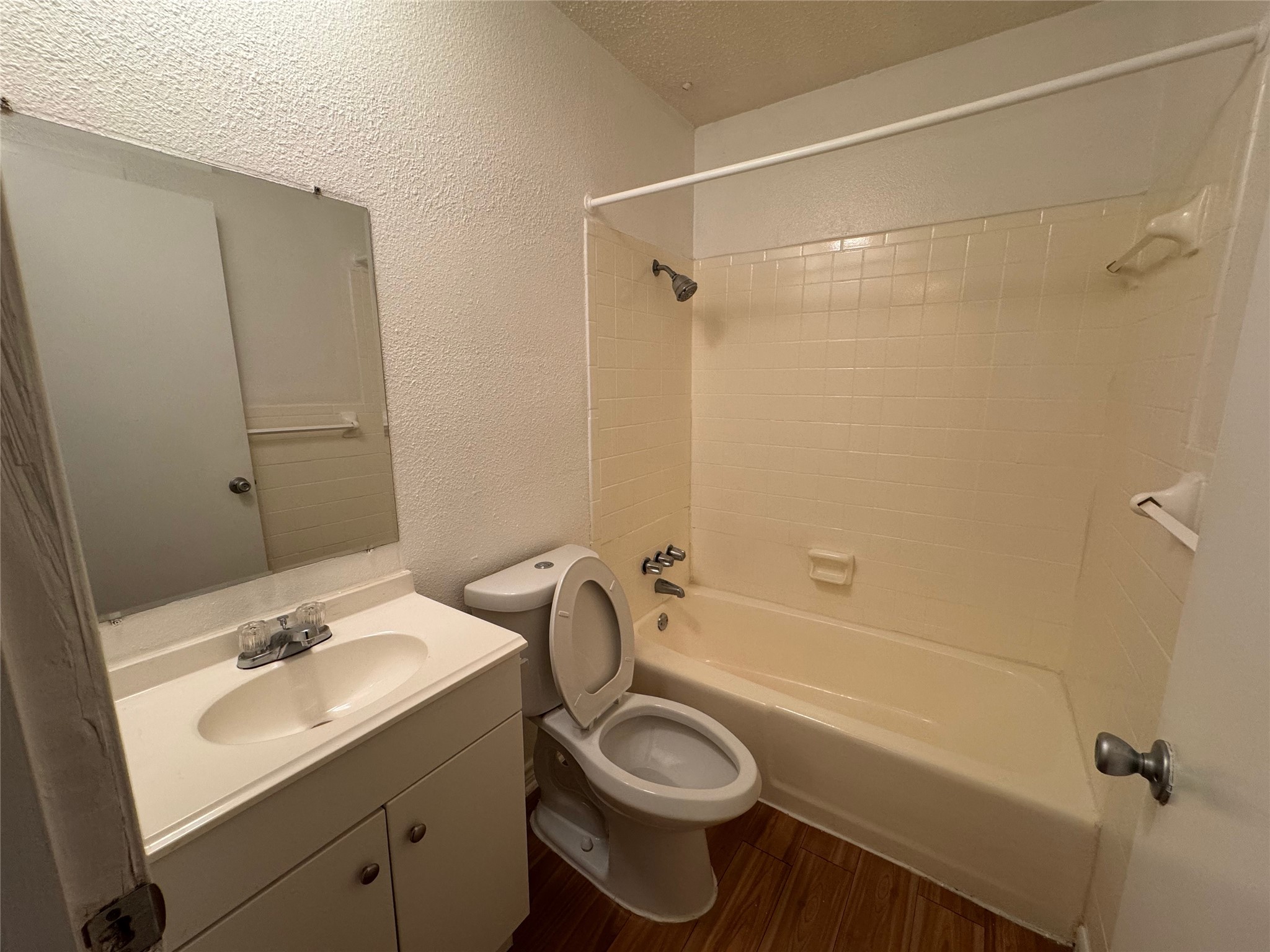 4810 West Wind Trail, Unit 102 Austin, TX 78745 - Photo 11 of 23 a bathroom with a sink toilet and shower