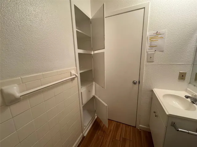 a bathroom with a sink and shower