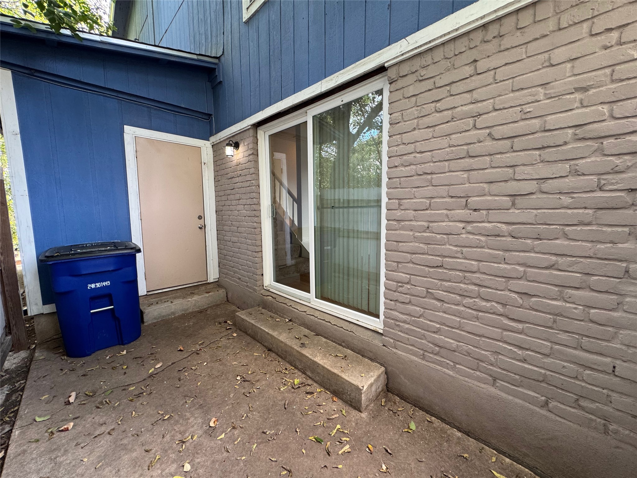 4810 West Wind Trail, Unit 102 Austin, TX 78745 - Photo 20 of 23 a view of a backyard with a chair and a potted plant