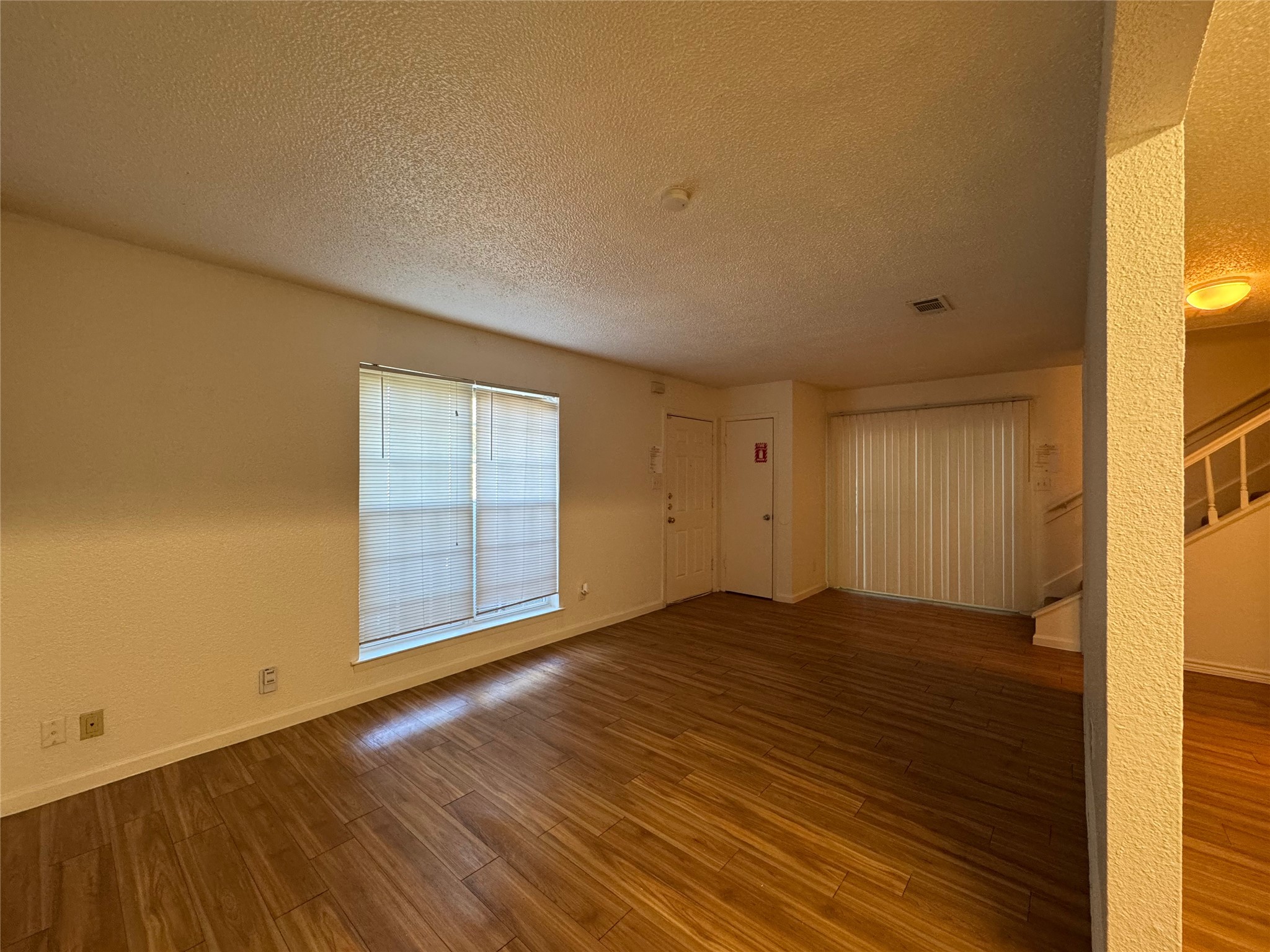 4810 West Wind Trail, Unit 102 Austin, TX 78745 - Photo 3 of 23 a view of an empty room and window