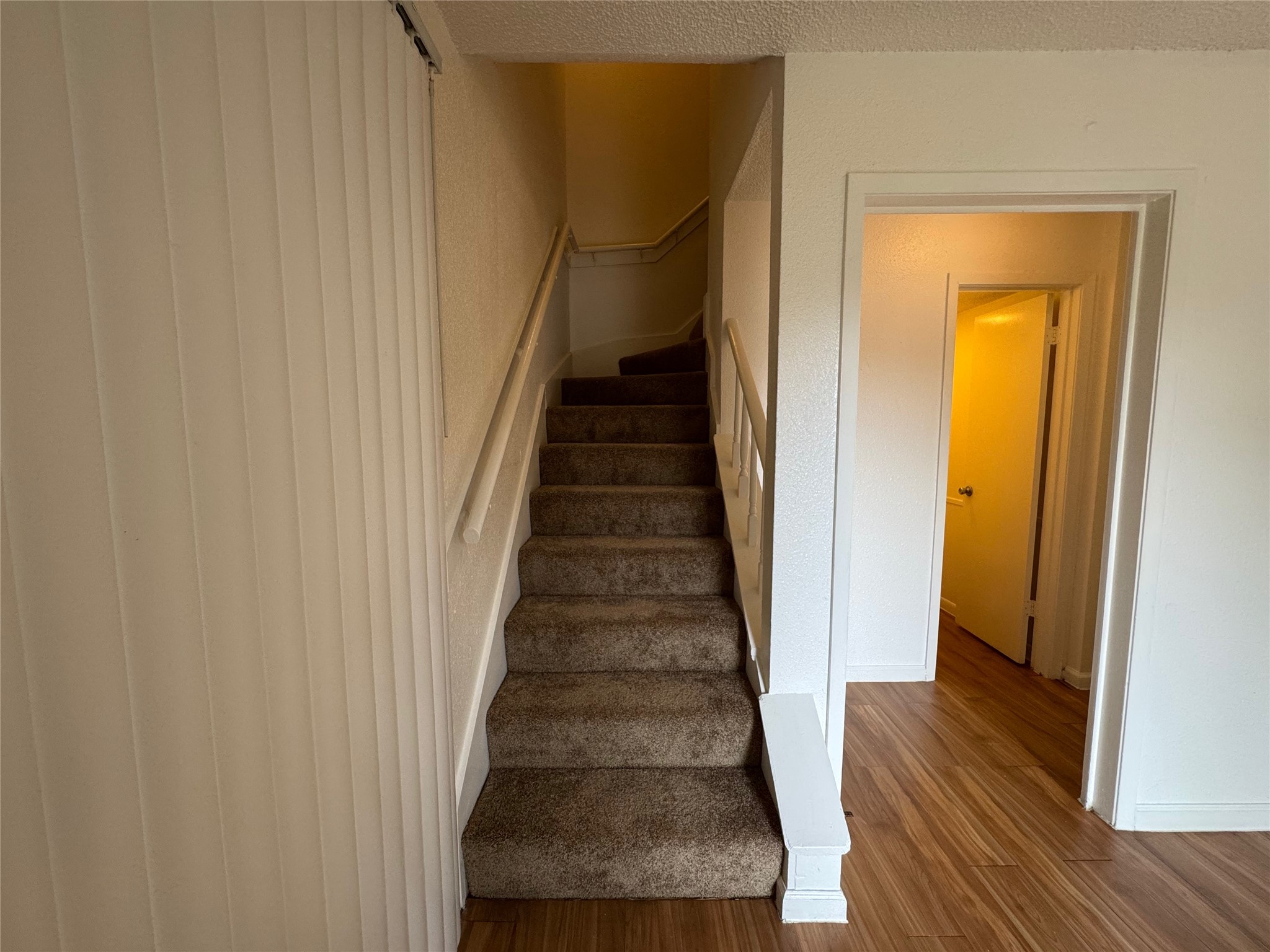 4810 West Wind Trail, Unit 102 Austin, TX 78745 - Photo 10 of 23 a view of entryway and hall with wooden floor