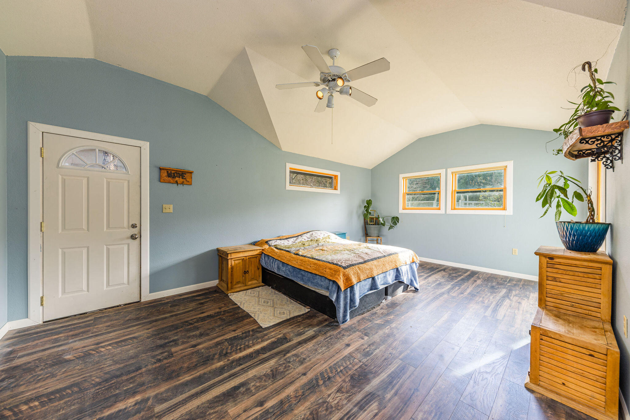 6732 Old Stage Road Central Point, OR 97502 - Photo 19 of 51 a bedroom with a bed and wooden floor
