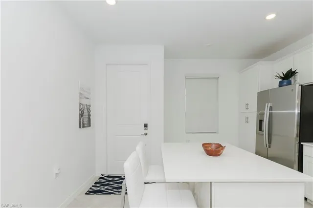 a view of kitchen with a refrigerator