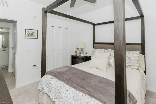 a bedroom with a bed and a cabinets