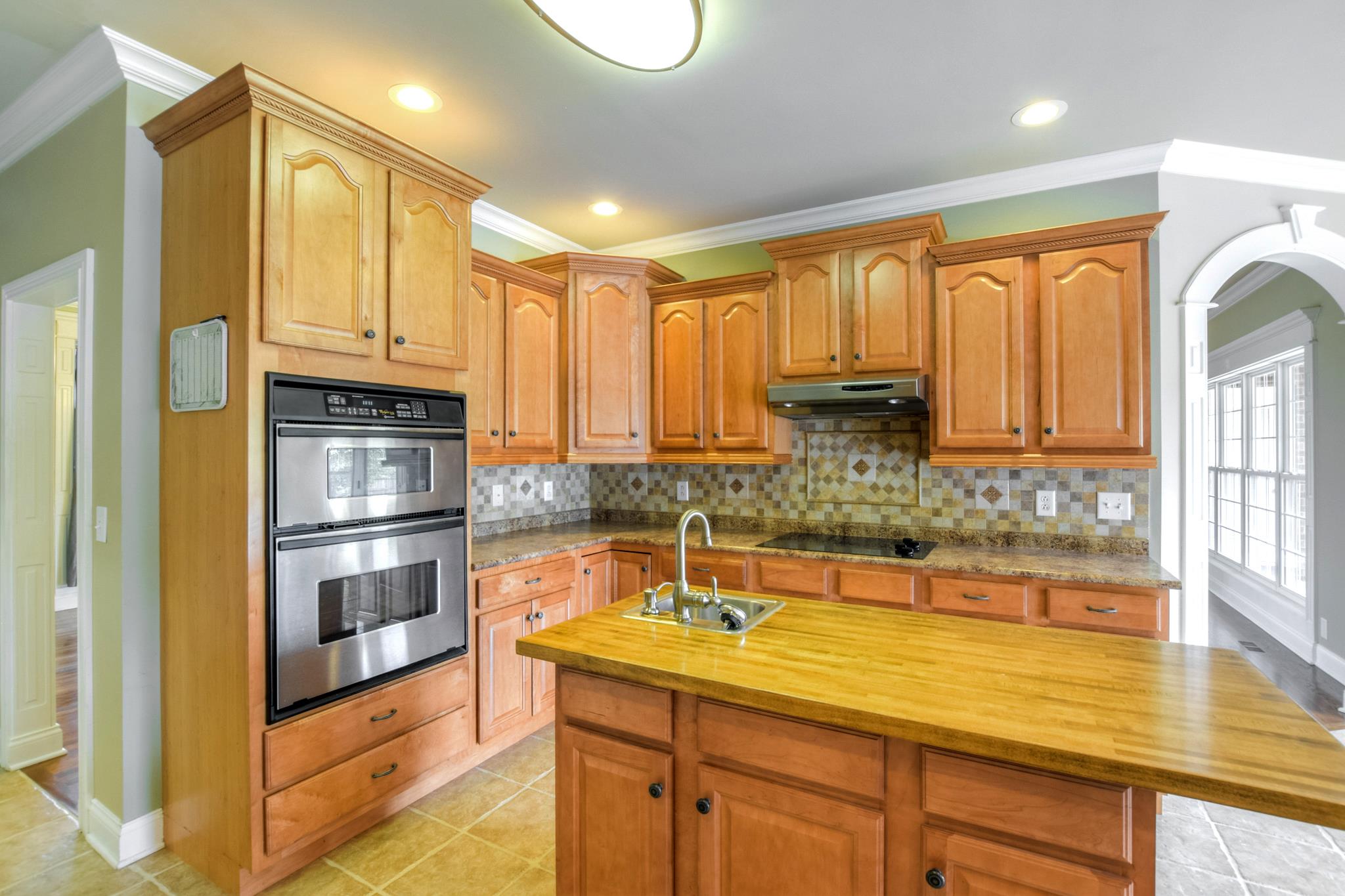 3914 Rowland Road Murfreesboro, TN 37128 - Photo 9 of 29 a kitchen with stainless steel appliances granite countertop a sink and cabinets