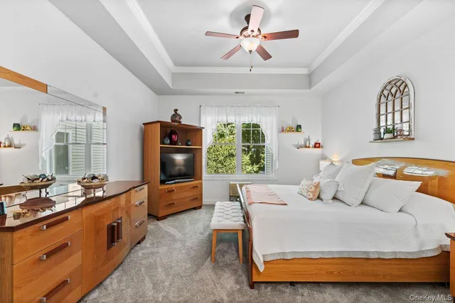 a bedroom with furniture and a window