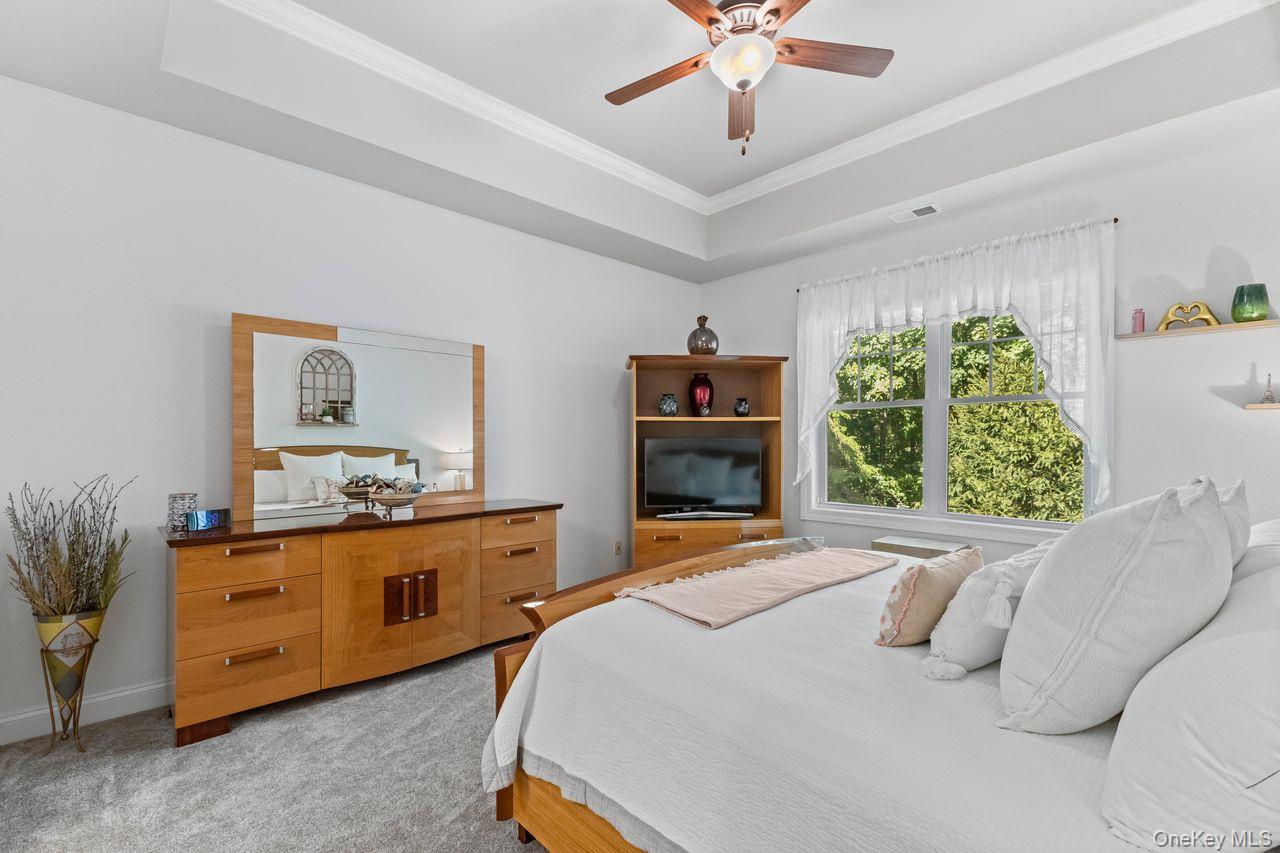 43 Yesterday Drive Cold Spring, NY 10516 - Photo 12 of 36 Primary bedroom features tray ceiling with ceiling fan.
