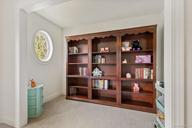 a view of a house with a big yard potted plants and large tree