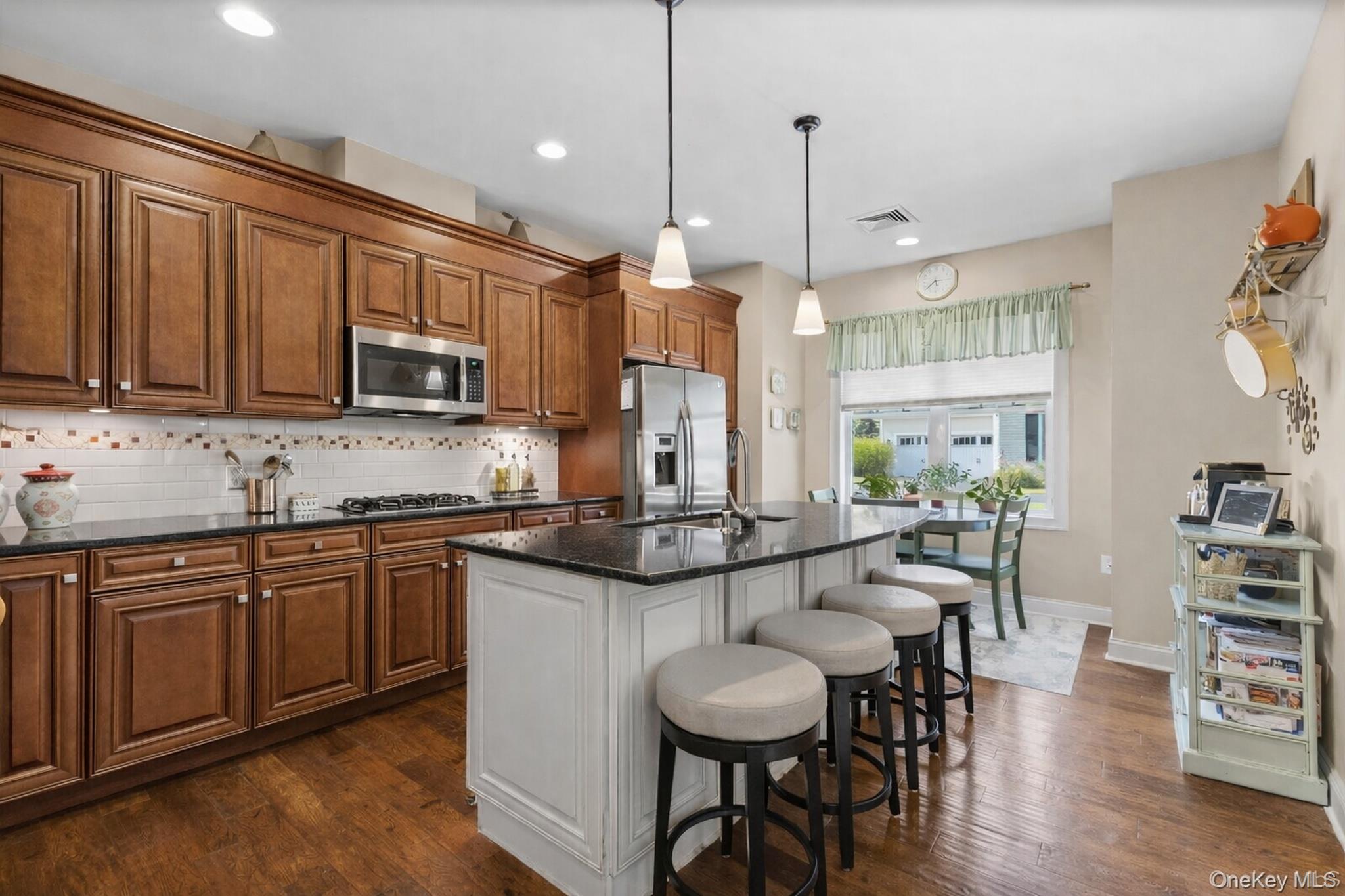 43 Yesterday Drive Cold Spring, NY 10516 - Photo 6 of 36 Gourmet eat in kitchen with double oven, gas cooktop, built in microwave and island with dishwasher. Virtually painted kitchen-