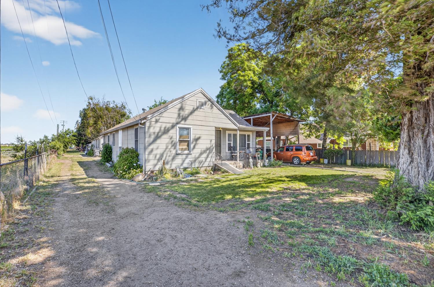 383 Taylor Road Lodi, CA 95242 - Photo 3 of 22 a view of a house with a yard and sitting area