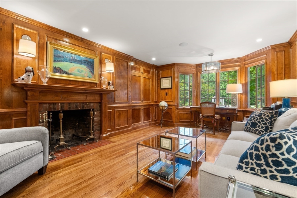 193 Winding River Road Wellesley, MA 02482 - Photo 17 of 42 a living room with furniture fireplace and large windows