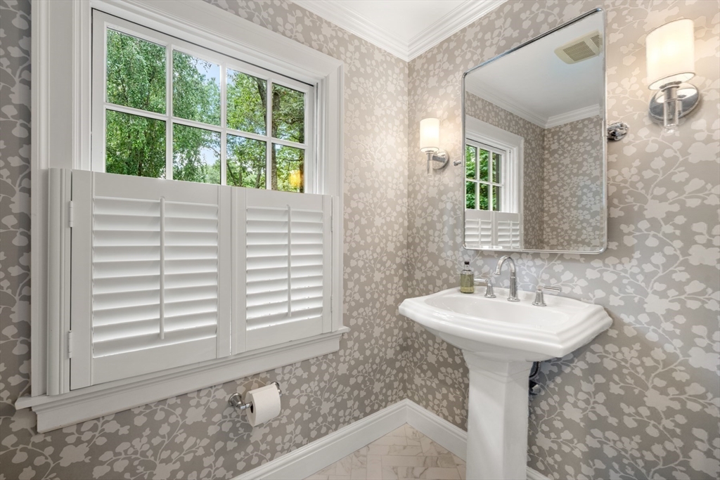 193 Winding River Road Wellesley, MA 02482 - Photo 20 of 42 a bathroom with a sink a mirror and a bathtub