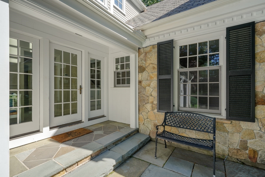 193 Winding River Road Wellesley, MA 02482 - Photo 2 of 42 a view of a balcony with a lounge chair