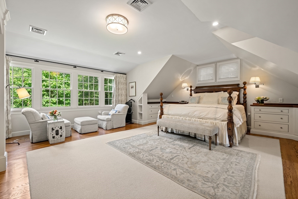 193 Winding River Road Wellesley, MA 02482 - Photo 22 of 42 a bedroom with a large bed and a large window