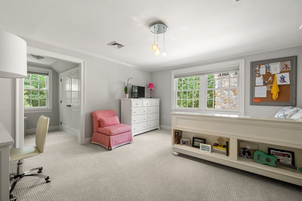 193 Winding River Road Wellesley, MA 02482 - Photo 27 of 42 a living room with furniture and a window
