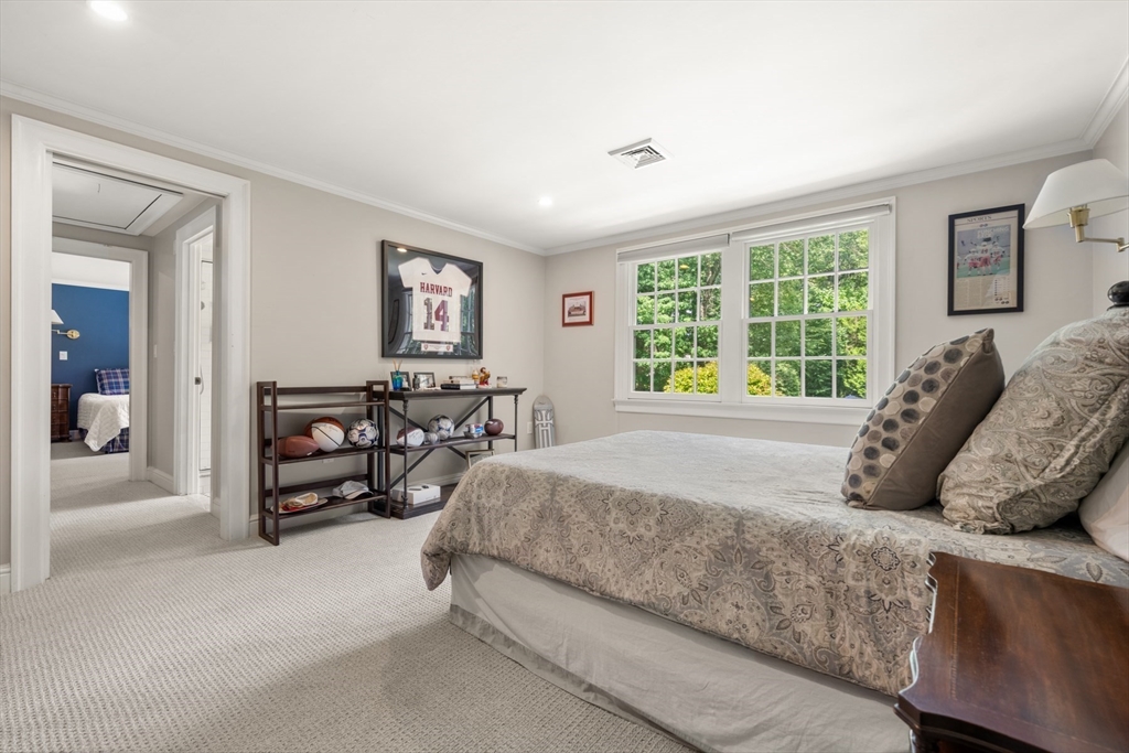 193 Winding River Road Wellesley, MA 02482 - Photo 28 of 42 a bedroom with a bed and a couch