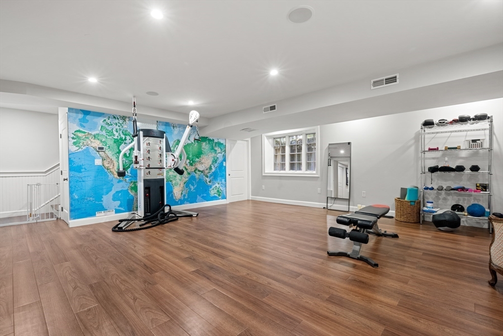 193 Winding River Road Wellesley, MA 02482 - Photo 32 of 42 a view of a room with gym equipment and floor to ceiling window