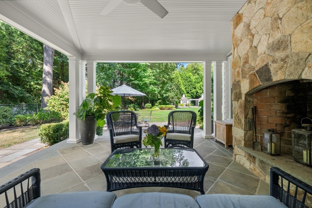 193 Winding River Road Wellesley, MA 02482 - Photo 34 of 42 a living room with patio furniture and a potted plants