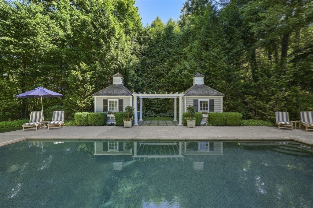 193 Winding River Road Wellesley, MA 02482 - Photo 37 of 42 a front view of a house with a yard