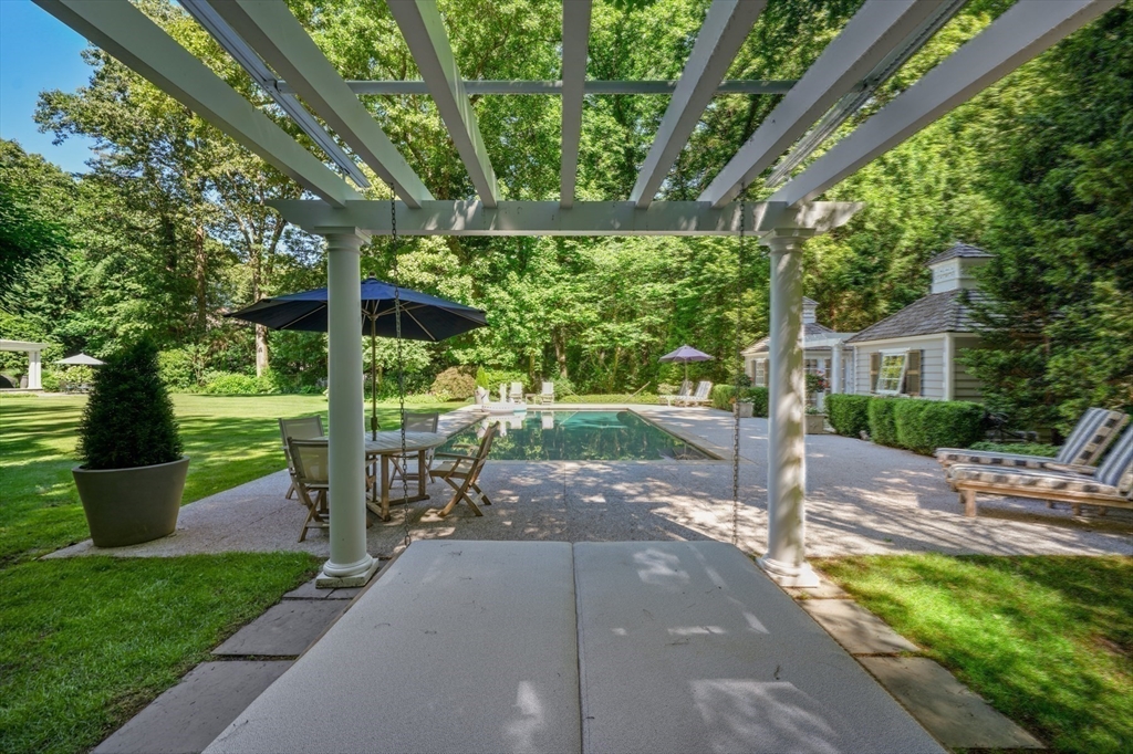 193 Winding River Road Wellesley, MA 02482 - Photo 40 of 42 a view of a park with large trees and plants