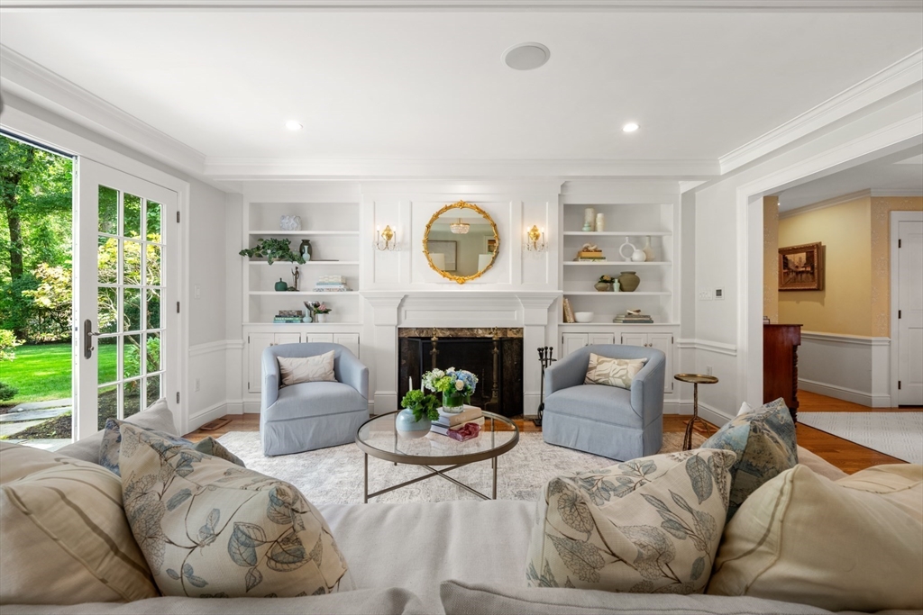 193 Winding River Road Wellesley, MA 02482 - Photo 4 of 42 a living room with furniture a fireplace and a large window