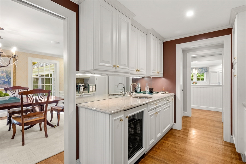 193 Winding River Road Wellesley, MA 02482 - Photo 6 of 42 a kitchen with a stove a sink and a refrigerator