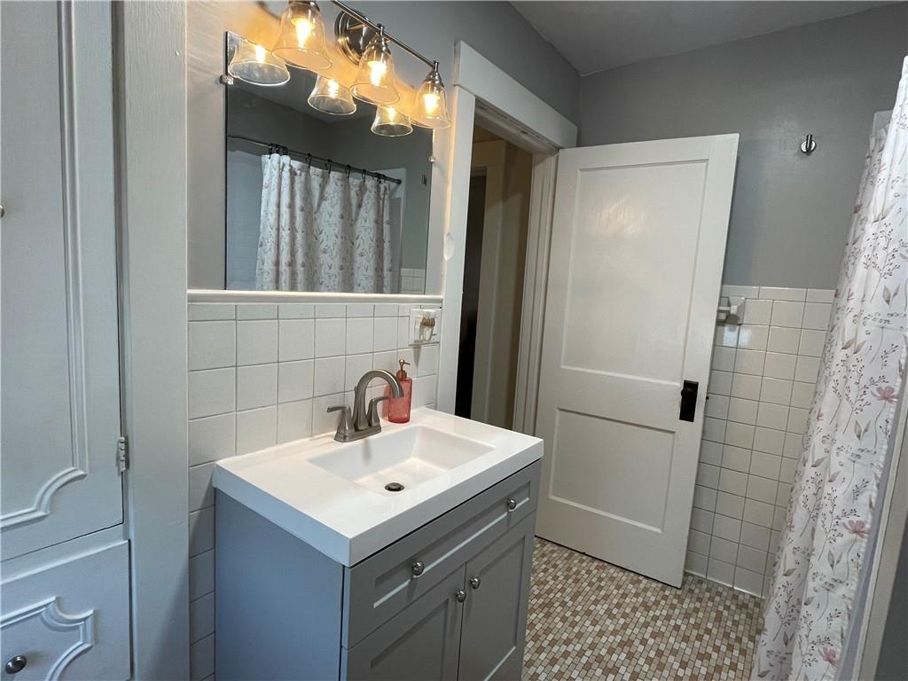 33 Line Street Sharpsville, PA 16150 - Photo 15 of 34 a bathroom with a sink a toilet and shower