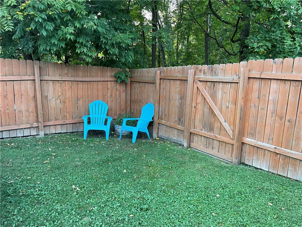 33 Line Street Sharpsville, PA 16150 - Photo 27 of 34 a view of a backyard with wooden fence and two chairs