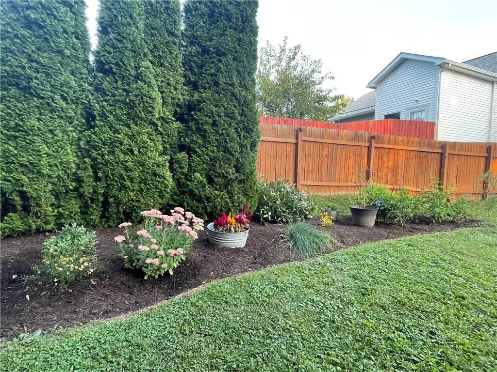 33 Line Street Sharpsville, PA 16150 - Photo 31 of 34 a view of a backyard with plants and flowers