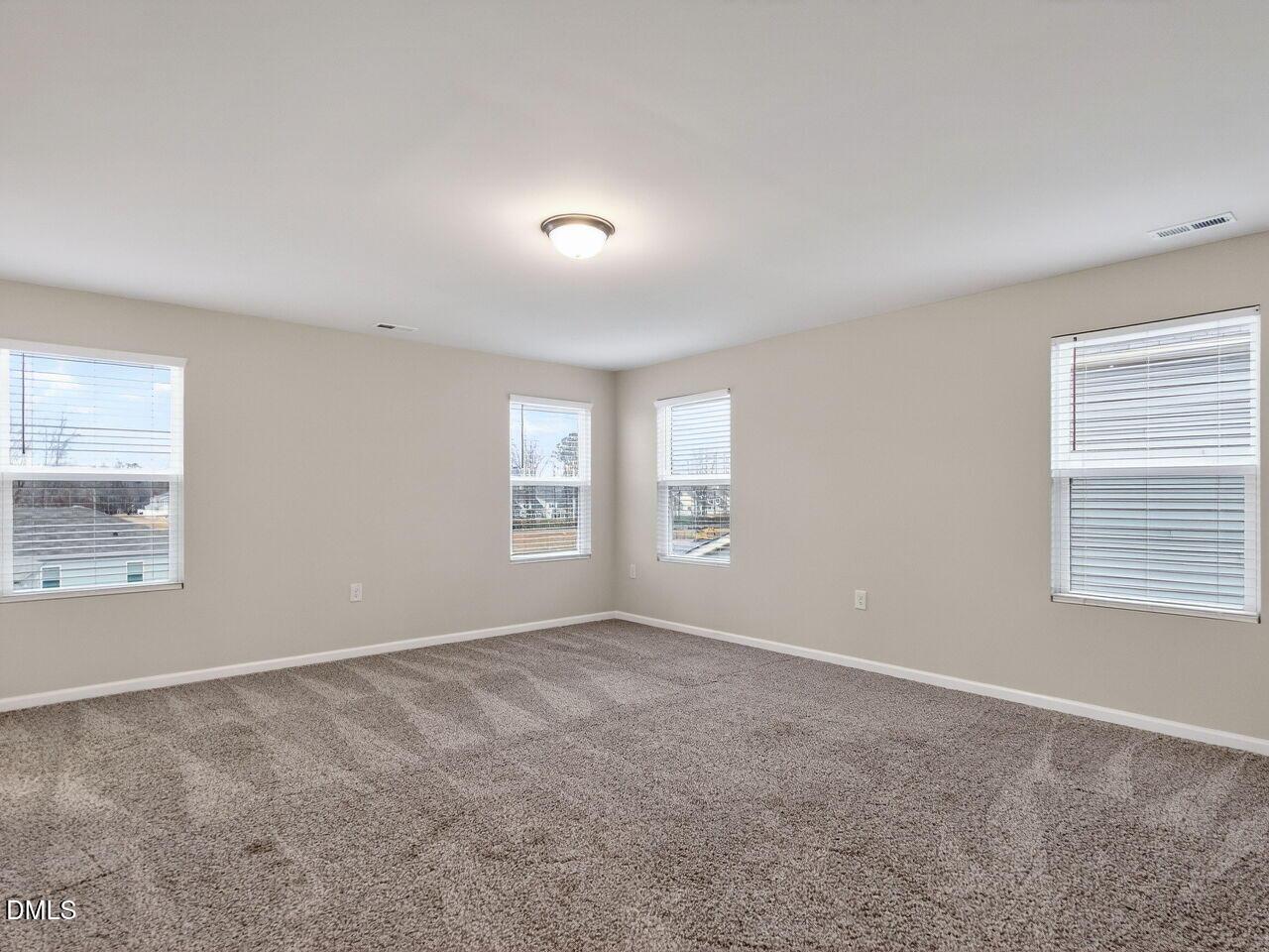 67 Coffee Tree Circle Clayton, NC 27527 - Photo 19 of 34 an empty room with windows