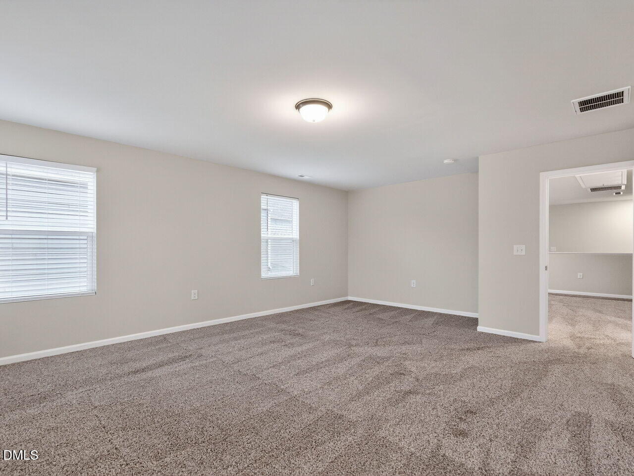 67 Coffee Tree Circle Clayton, NC 27527 - Photo 20 of 34 an empty room with windows