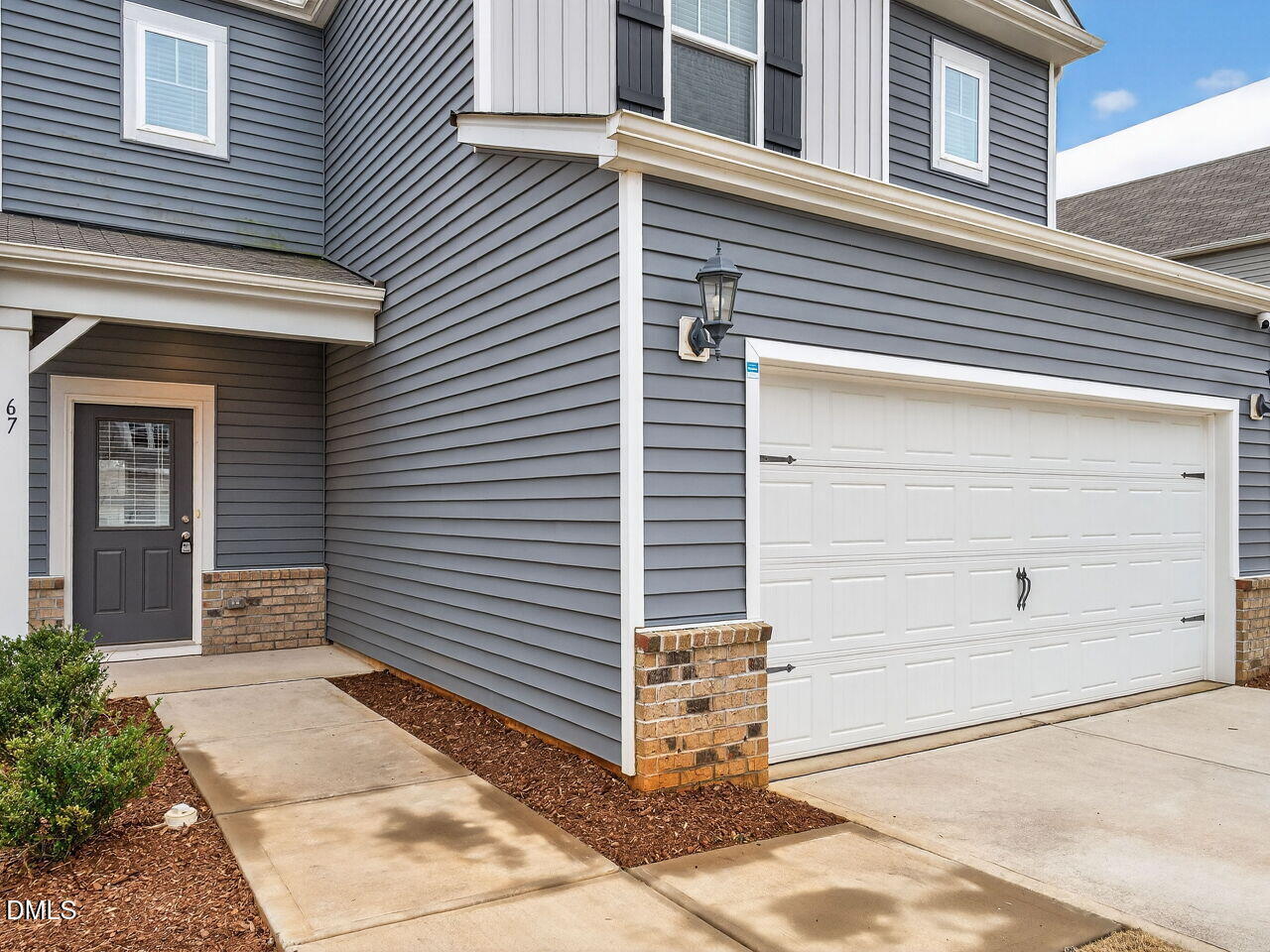 67 Coffee Tree Circle Clayton, NC 27527 - Photo 2 of 34 a view of a house with white door and a window