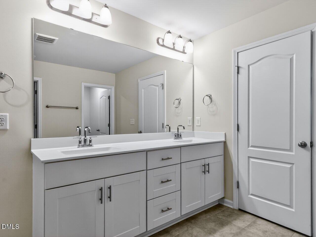 67 Coffee Tree Circle Clayton, NC 27527 - Photo 22 of 34 a bathroom with double sink and a mirror
