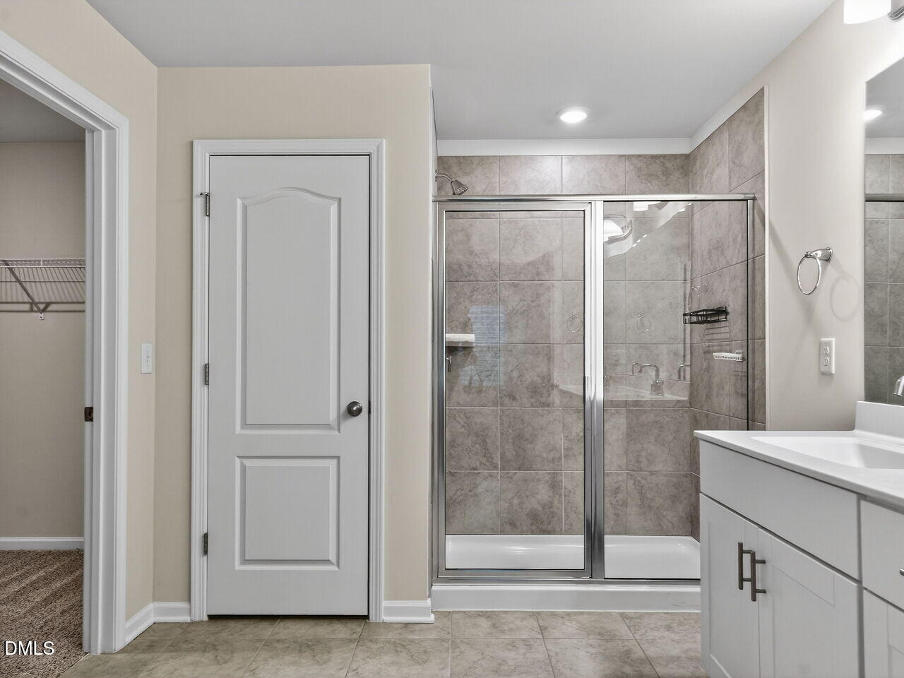 67 Coffee Tree Circle Clayton, NC 27527 - Photo 24 of 34 a bathroom with a shower and a sink