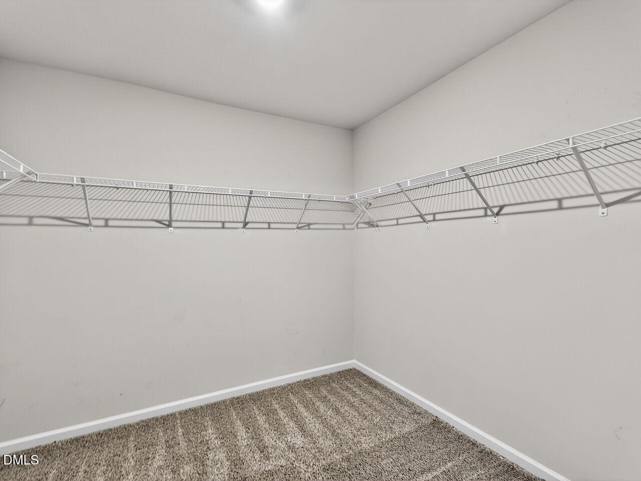 67 Coffee Tree Circle Clayton, NC 27527 - Photo 25 of 34 a view of a room with racks on the wall