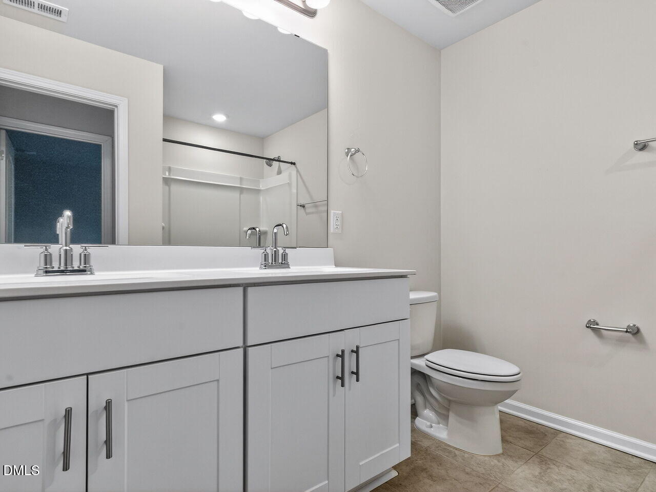 67 Coffee Tree Circle Clayton, NC 27527 - Photo 27 of 34 a bathroom with a sink toilet and mirror