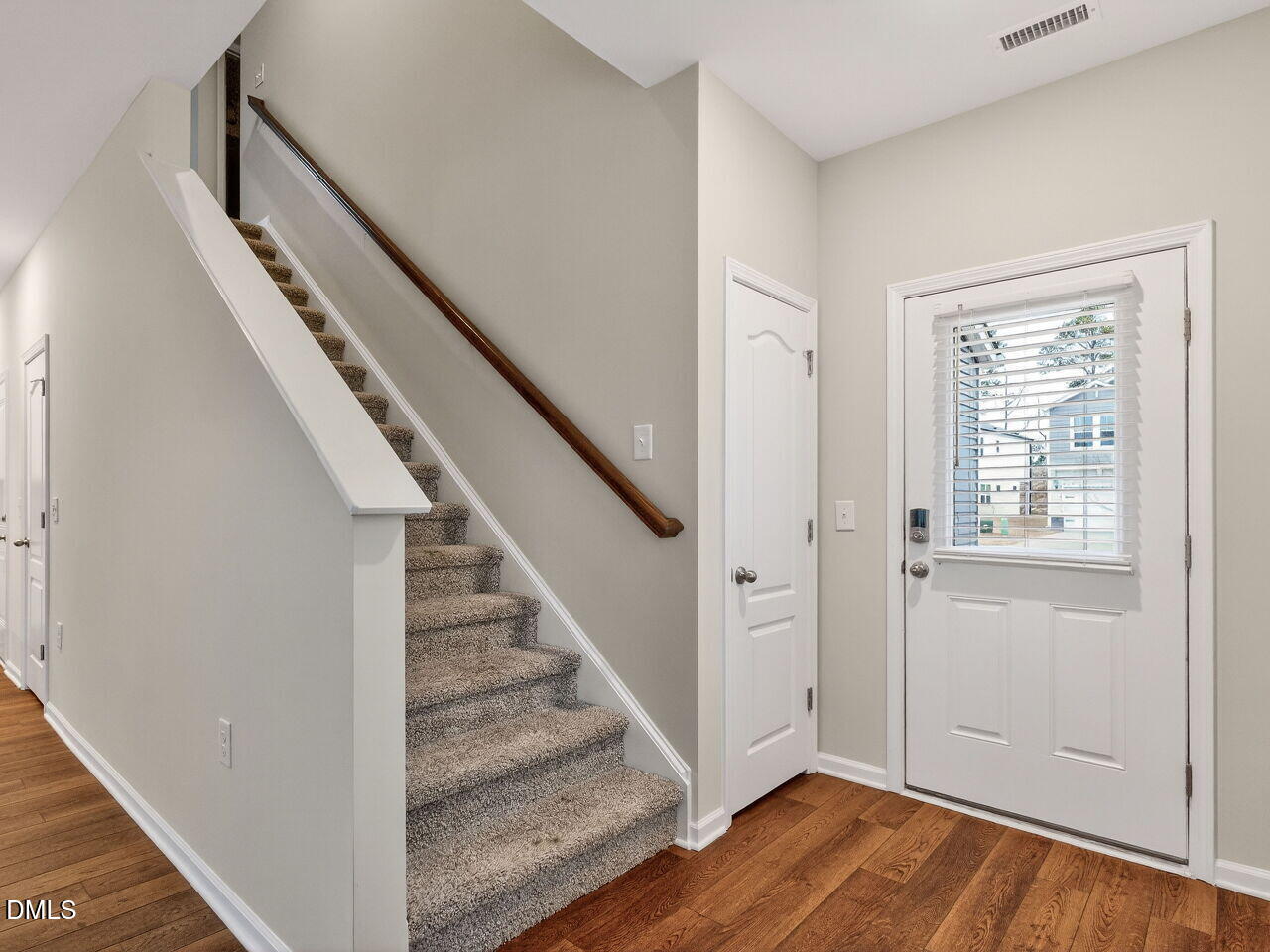 67 Coffee Tree Circle Clayton, NC 27527 - Photo 3 of 34 a view of entryway with wooden floor and stairs