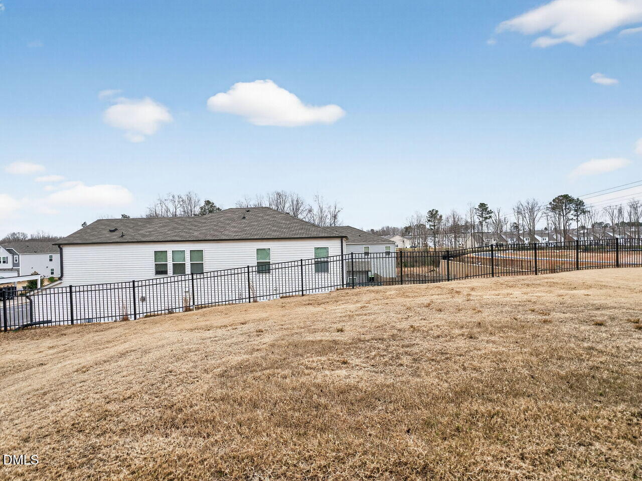 67 Coffee Tree Circle Clayton, NC 27527 - Photo 31 of 34 a view of a house with a big yard and large trees