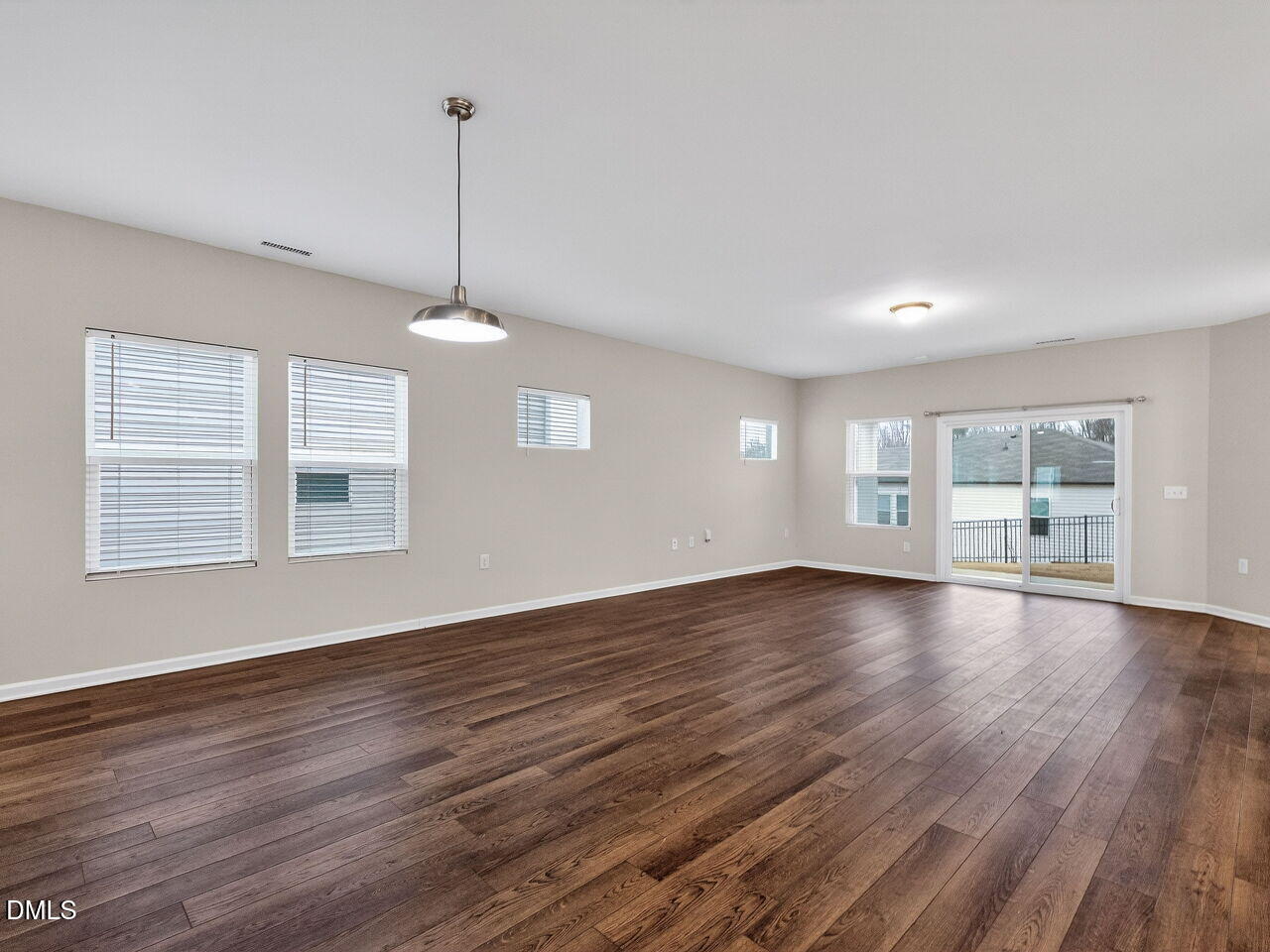 67 Coffee Tree Circle Clayton, NC 27527 - Photo 5 of 34 a view of a room with wooden floor and windows