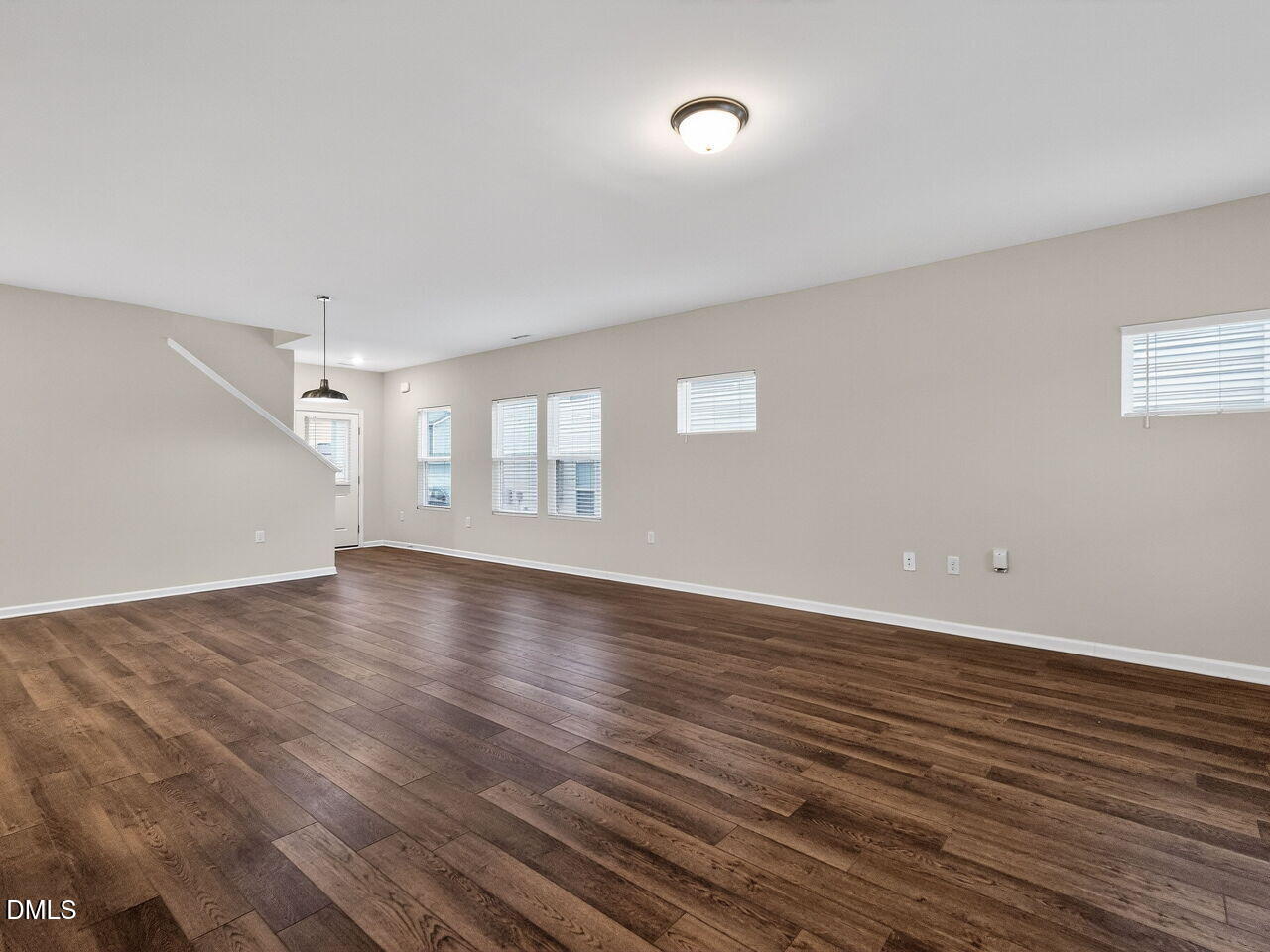 67 Coffee Tree Circle Clayton, NC 27527 - Photo 9 of 34 wooden floor in an empty room with a window