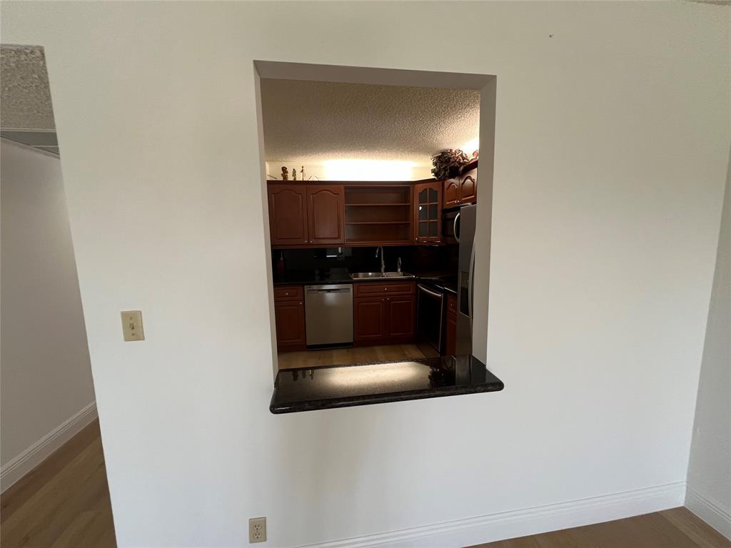 9300 Southwest 8th Street, Unit 422 Boca Raton, FL 33428 - Photo 13 of 38 a bathroom with a sink and a mirror