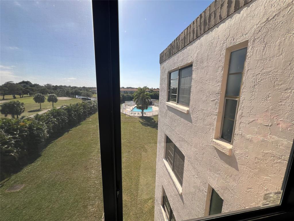 9300 Southwest 8th Street, Unit 422 Boca Raton, FL 33428 - Photo 24 of 38 a balcony with view of lake