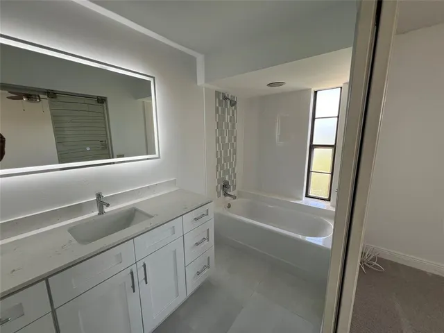 a bathroom with a toilet sink and shower