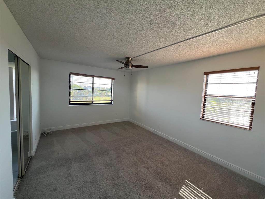 9300 Southwest 8th Street, Unit 422 Boca Raton, FL 33428 - Photo 35 of 38 a view of an empty room with a window