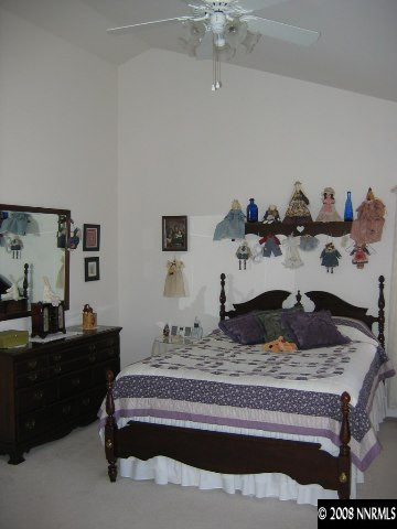 1930 Constellation Court Reno, NV 89523 - Photo 6 of 9 a living room with a bed and a dresser