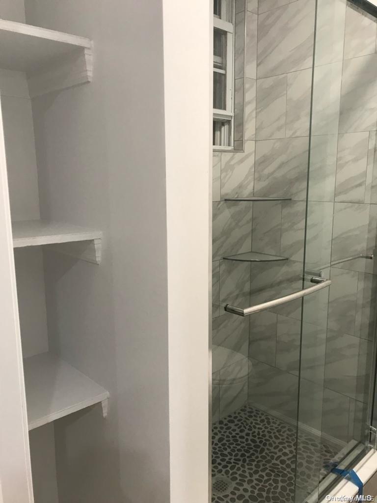 453 Ridgewood Avenue, Unit 2 Brooklyn, NY 11208 - Photo 7 of 11 Full bathroom with a shower stall