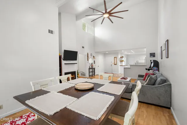 a large kitchen with stainless steel appliances granite countertop a refrigerator and a stove top oven